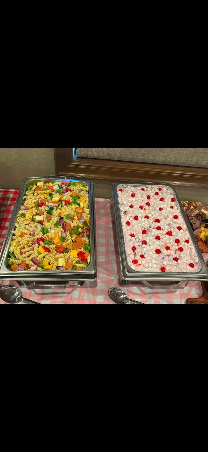 Pasta salad and a creamy side topped with cherries